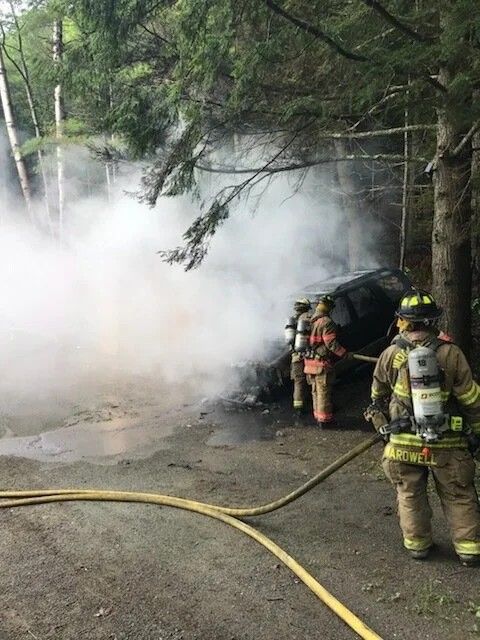 Woodstock Fire Department fighting a fire in the woods Woodstock Fire Department fighting a fire in the woods