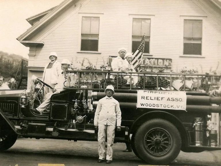 historic fire truck and members of fire department